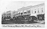 Postcard, 'East Side of Main St., Monticello, Wis.'  R-L: Jake Rupp Saloon, Steinman's Cash Clothing, and Peoples Supply Co.  The Peoples Supply building is the home of the Monticello Area Historical Society museum.
